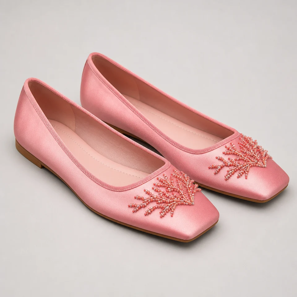 Pair of coral-pink square-toe flat shoe designs with branching bead-like embellishments