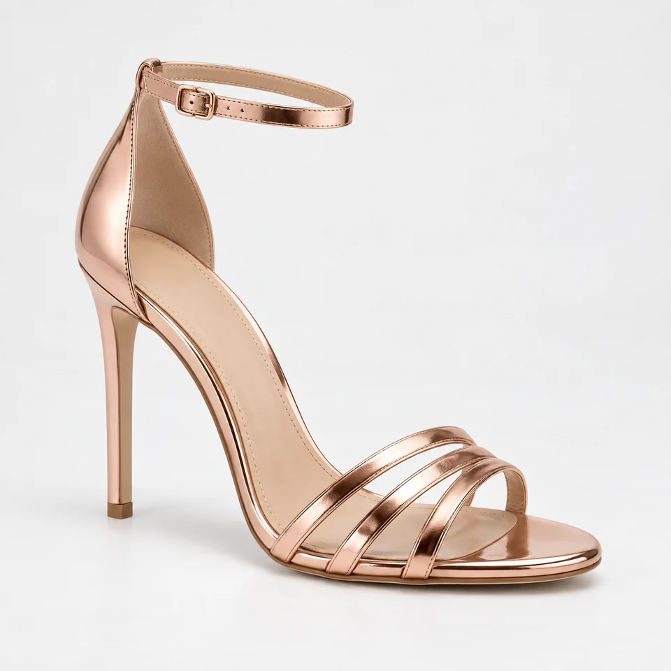 Metallic rose gold-look stiletto sandal with three narrow front straps and ankle buckle strap