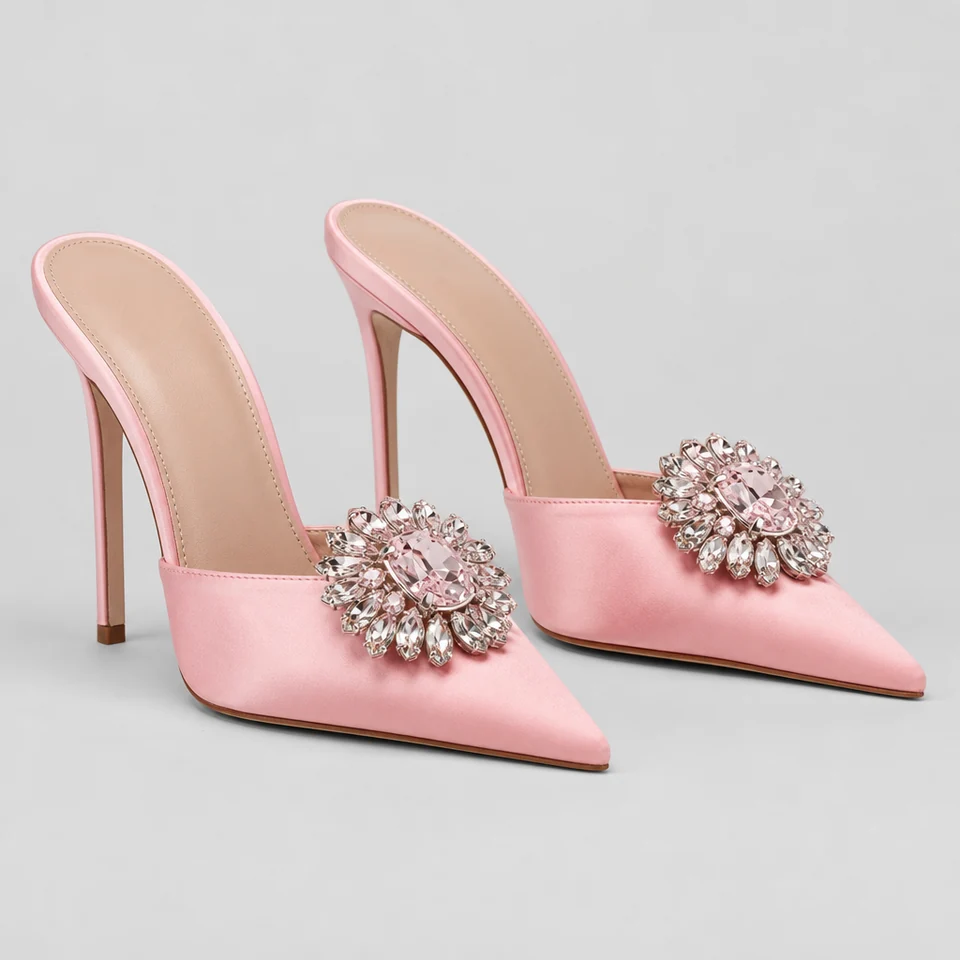 Pink satin-look mule with pointed open toe and crystal embellishment, high stiletto heel