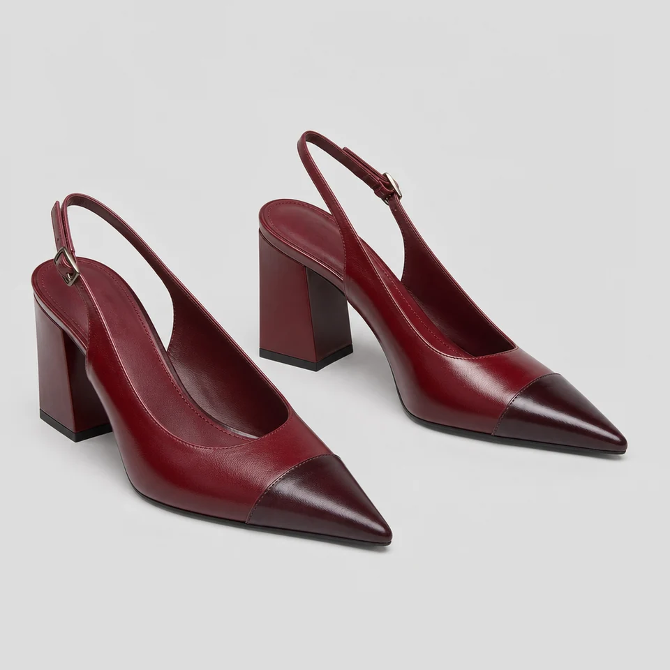 Red pointed slingback pumps with darker red glossy cap toes and chunky block heels