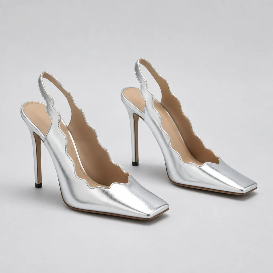 Pair of silver slingback pumps with scalloped edges, open square toe and high stiletto heels