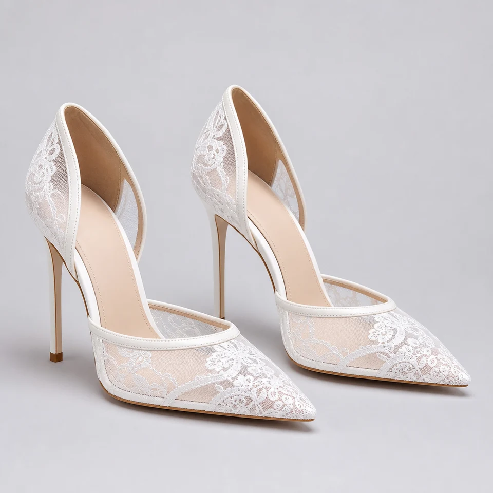 White pointed high stiletto pumps with floral lace-look mesh sides and back